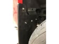 Bracket  in the wheel well with the flap