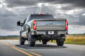 Picture of Truck Hardware Gatorback Gunmetal Ford Oval Offset Mud Flaps - Set of 4 - Fits 2023-2026 Ford F-250/F-350
